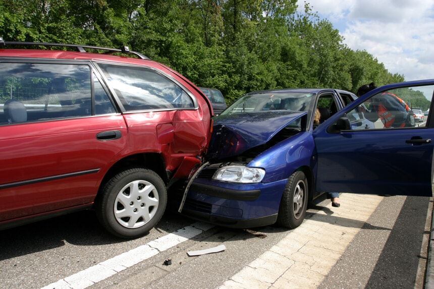 Blue car in a rear-end accident with a red car